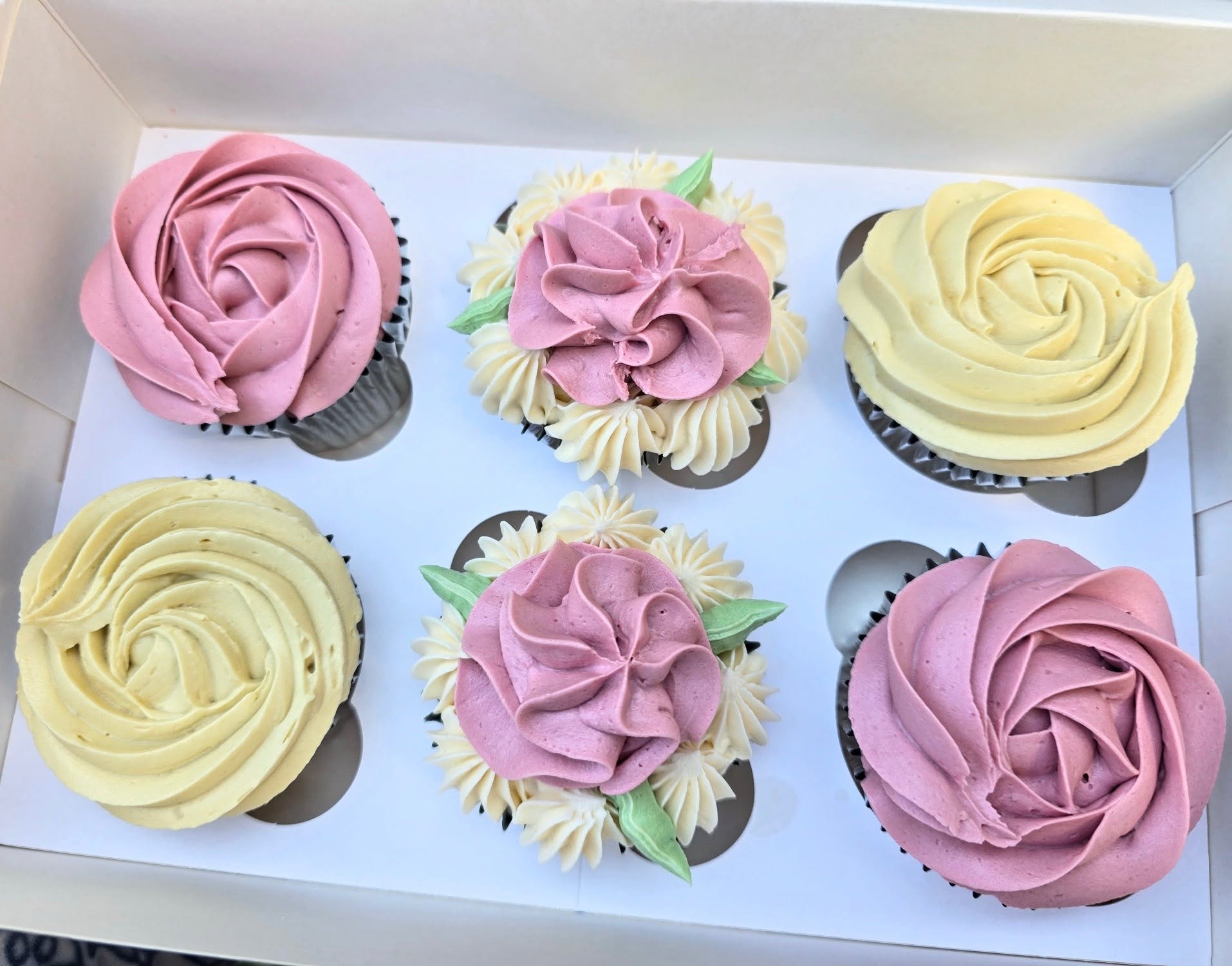 Pink and cream floral swirls, finished with delicate pearls.