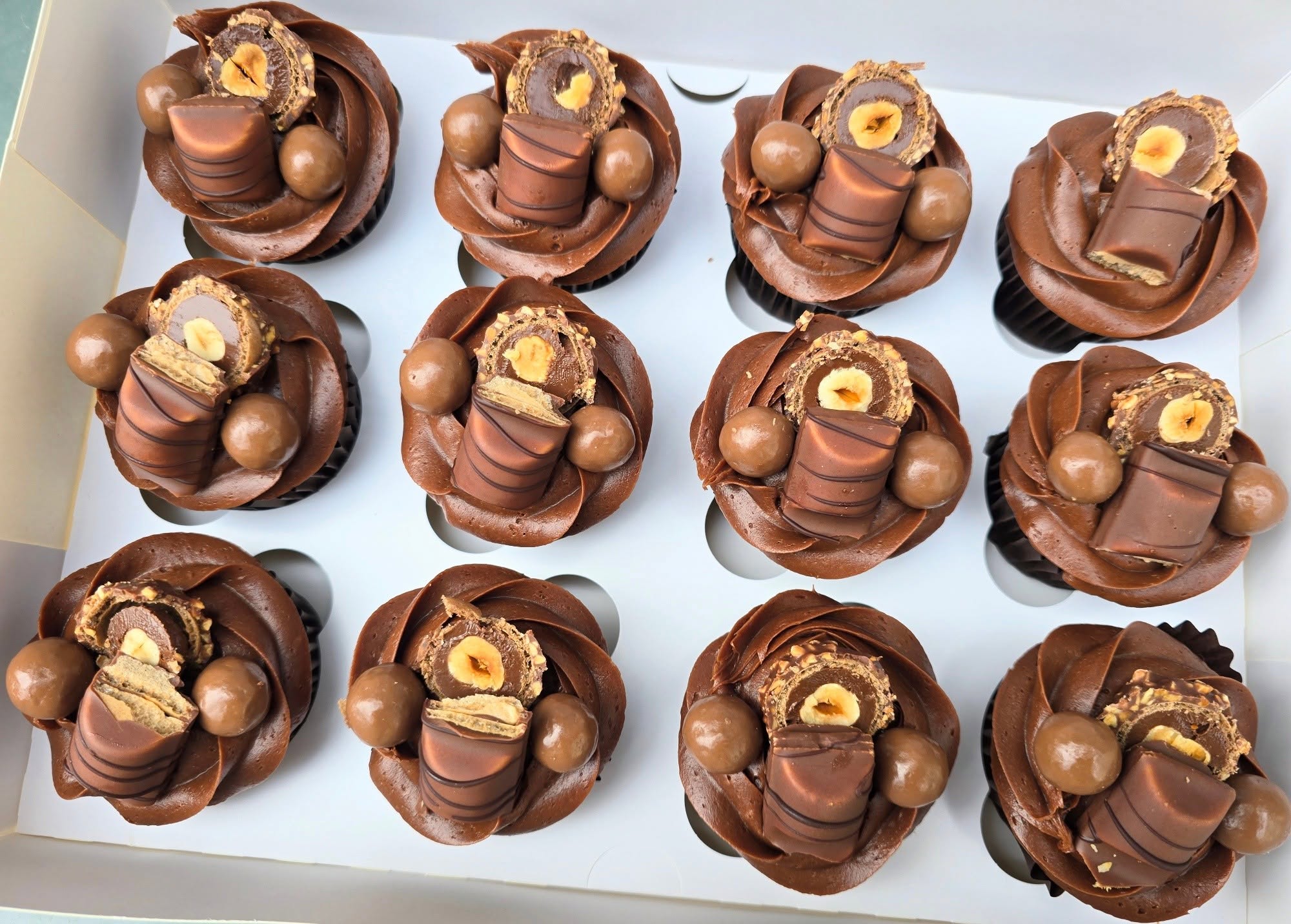 Chocolate swirls topped with a selection of chocolate treats.